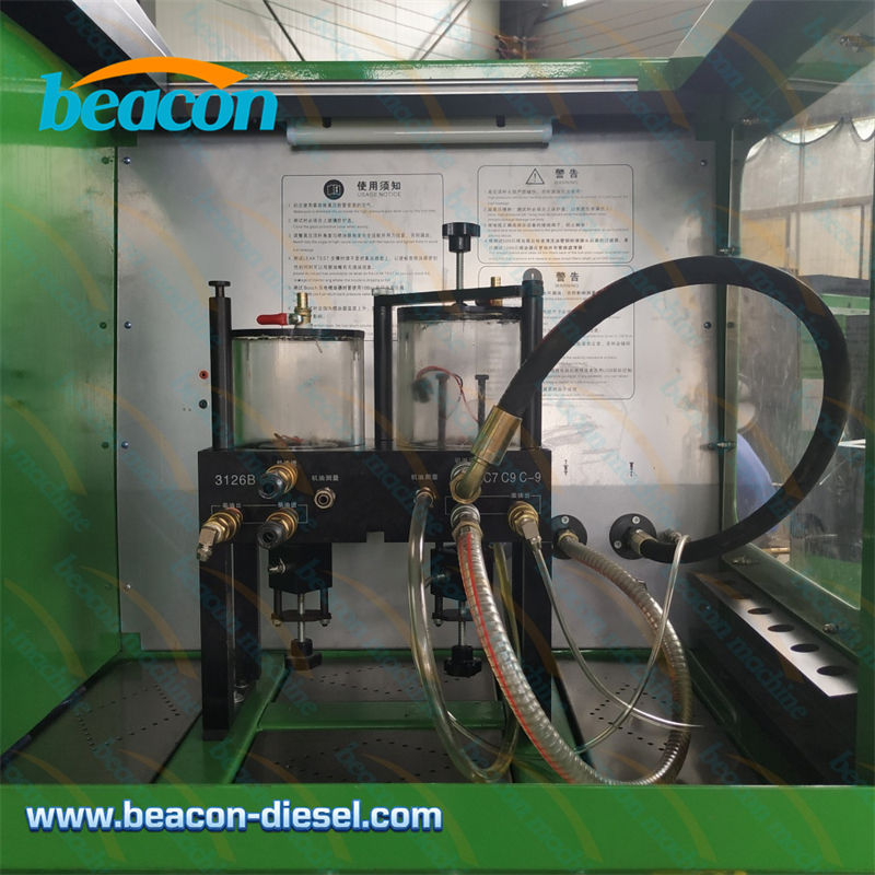 Рабочая зона стенда CR318: настройка для тестирования форсунок Caterpillar HEUI с подключением масляного и топливного контуров.